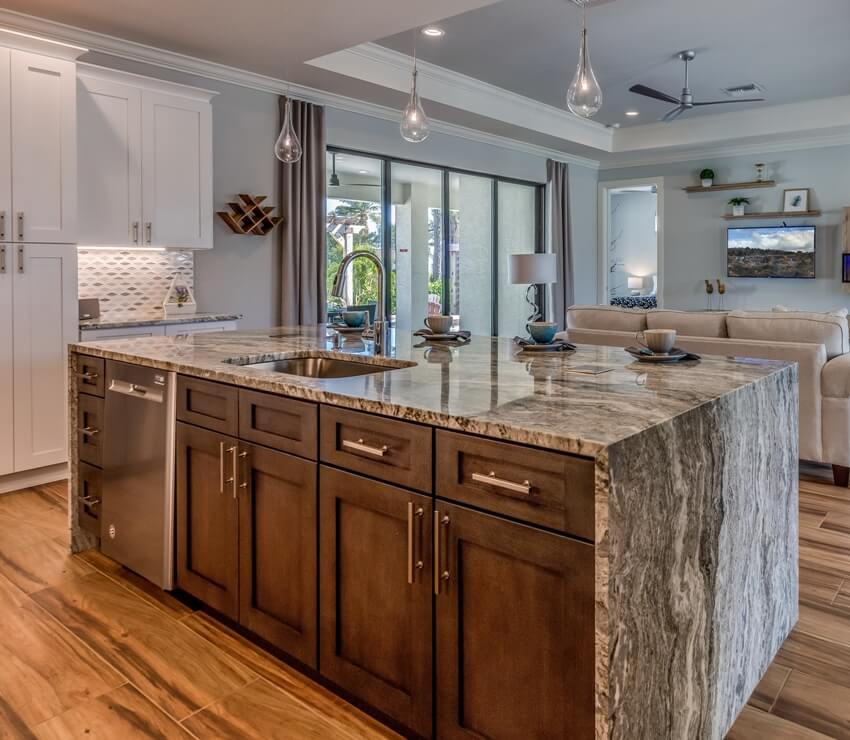 Waterfall composite marble kitchen island with wooden cabinets and floor and stylish hanging lights accessory 
