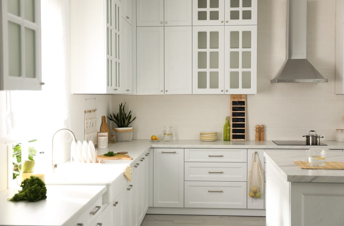 white kitchen with window and drawers