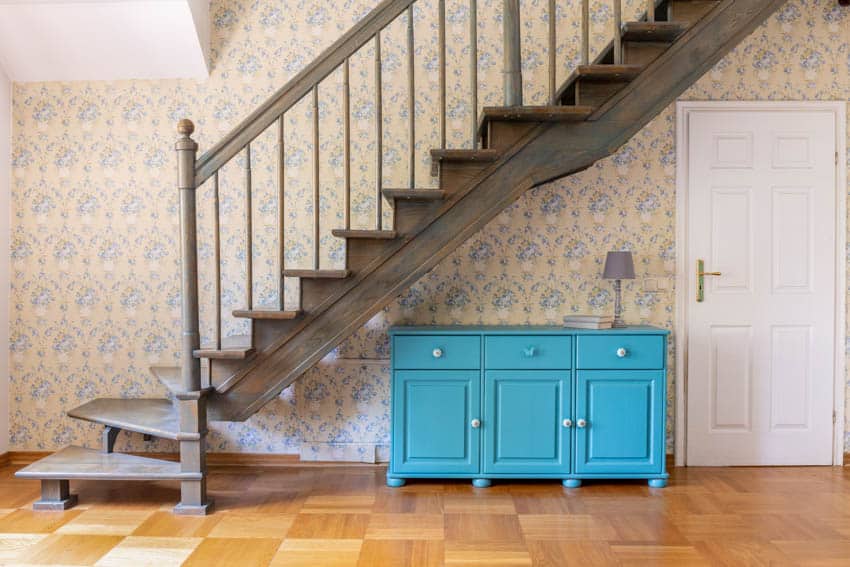 Wood stairs staircase wallpaper teal drawer cabinet wood floor white door