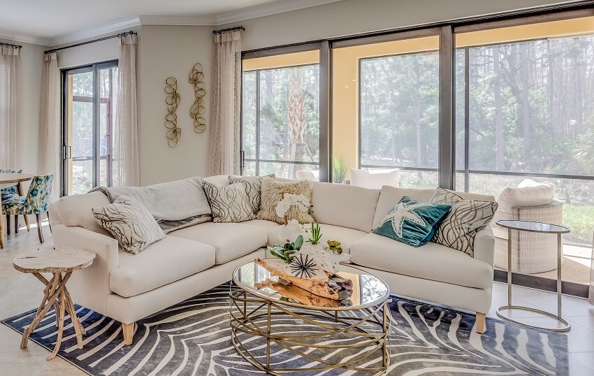 Zebra print rug and other colorful accents to the rest of the white in the room