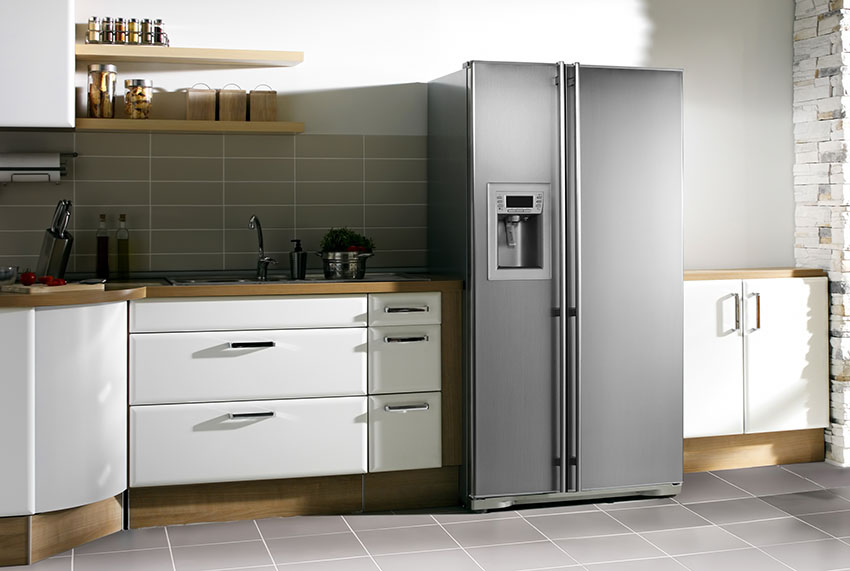 Modern kitchen with large fridge white cabinets