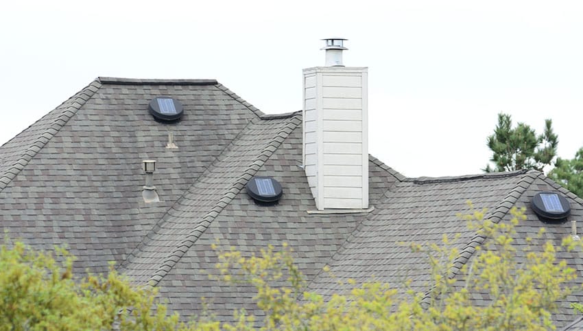 Roof with tubular skylights and chimney