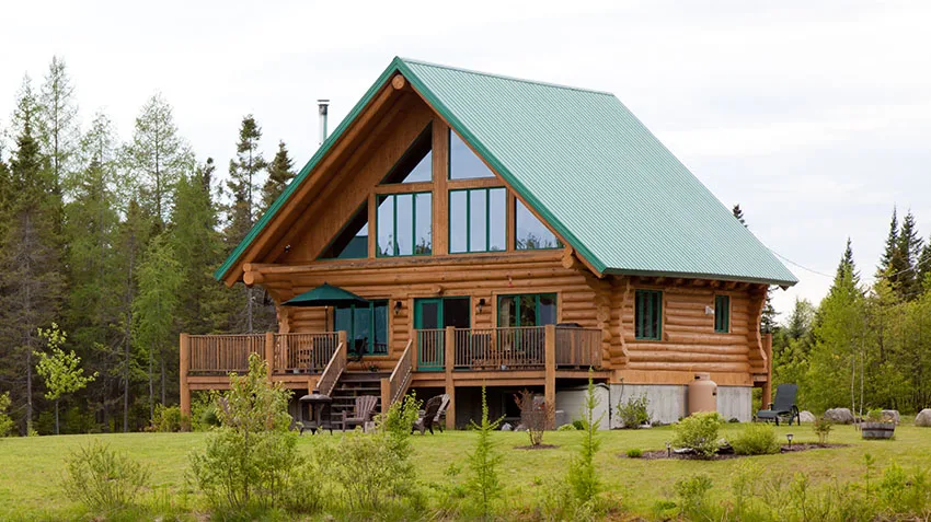 Wooden house with green roof