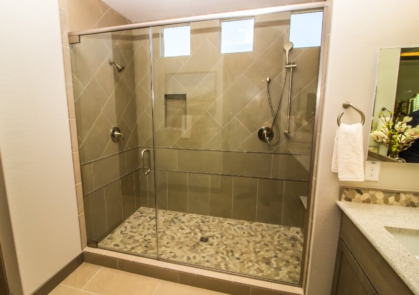 Bathroom shower with glass door tile wall windows & two shower heads