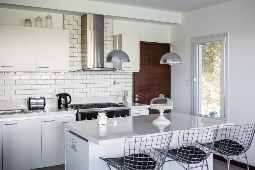 Beautiful white kitchen center island countertop hanging light cabinet tile backsplash