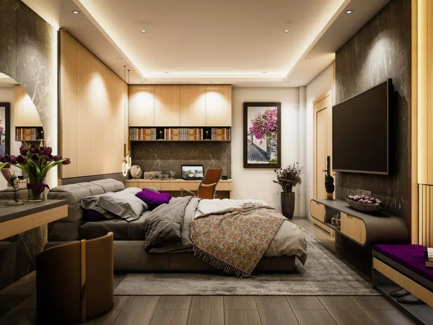 Bedroom tv wall mount rug wood floor recessed lighting home office study area nightstand