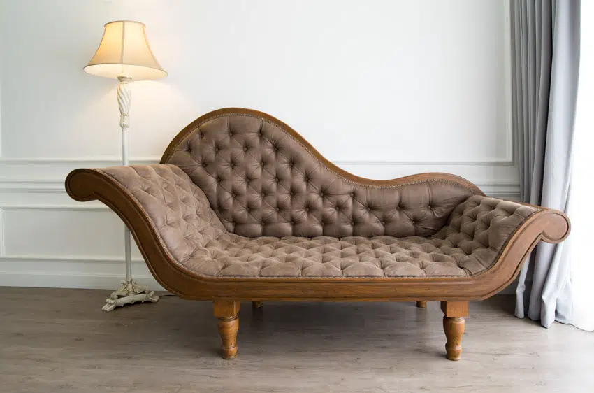 Brown chaise with antique decorative lamp