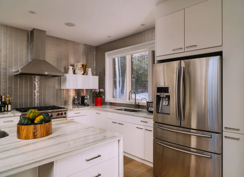 Butlers pantry stainless steel refrigerator backsplash hood countertop windows