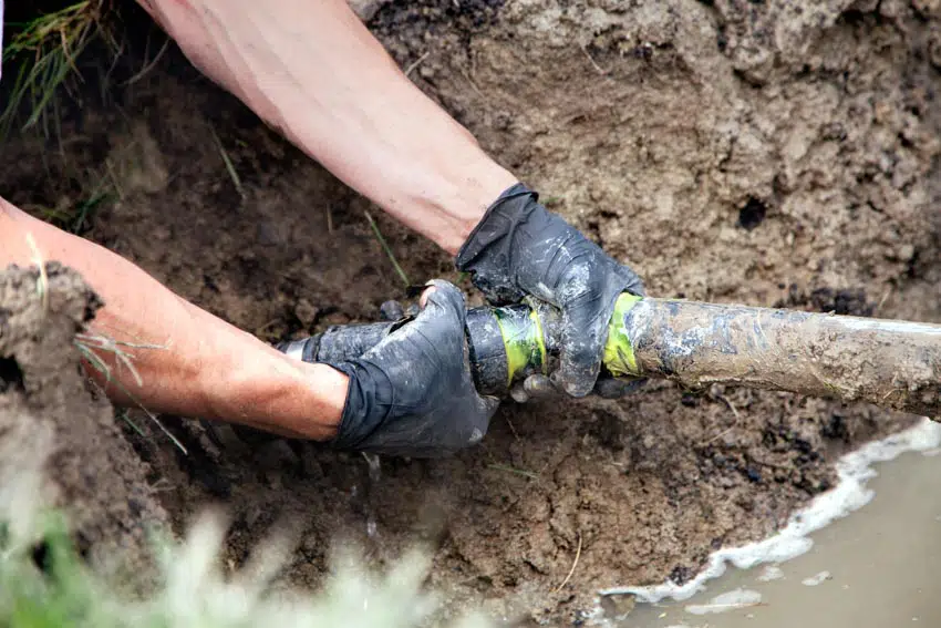 Contractor repairing pipeline 