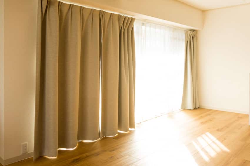 Empty room with blackout curtain wood flooring