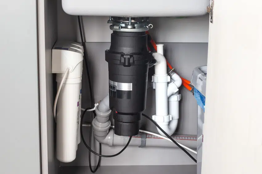 Garbage unit installed under kitchen sink