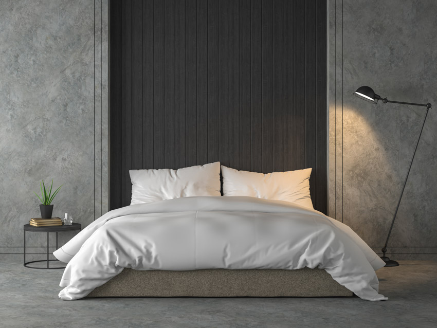 Gray wall black headboard floor lamp nightstand bedroom
