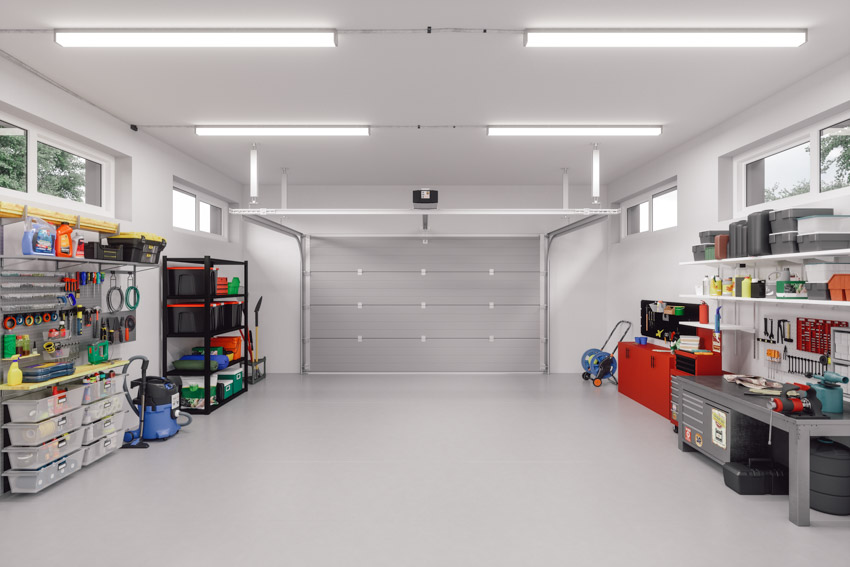 White garage with boxes full of tools and equipment