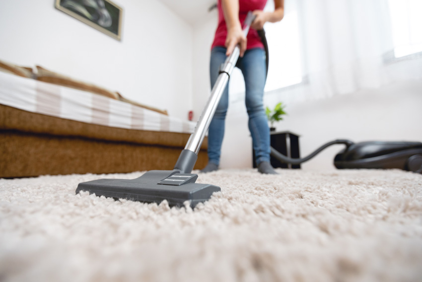 Individual cleaning carpet with a vacuum