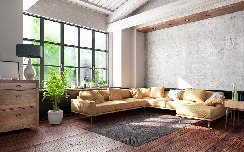 Industrial style loft apartment with yellow sofa concrete walls beams wood furnitures large windows and hardwood floors