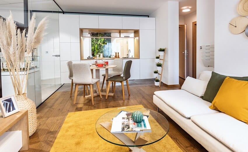 Interior of a room with yellow carpet on wooden floors