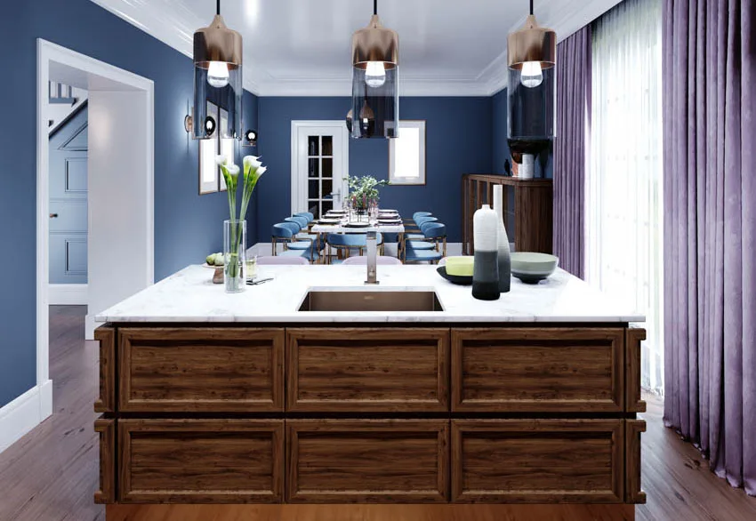 Kitchen island with white countertop blue wall purple curtain hanging light