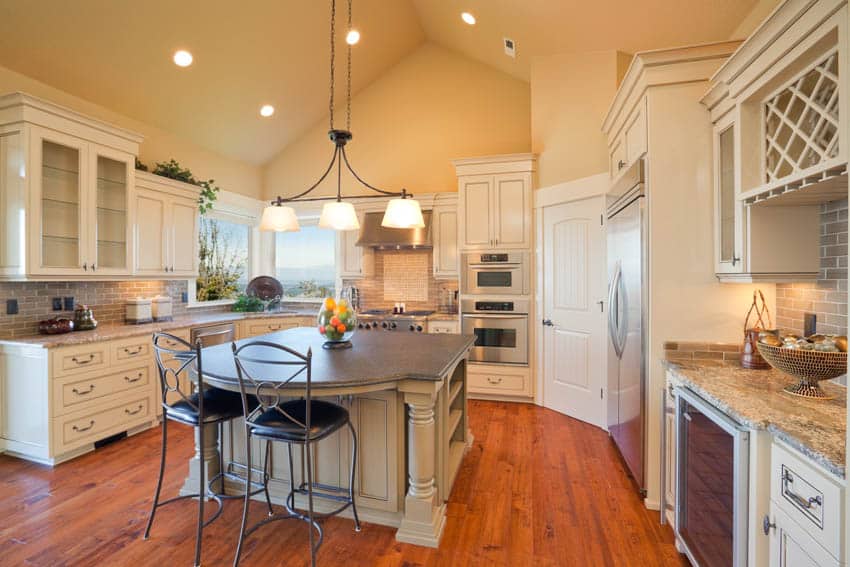 Kitchen pendant over countertop, cabinets and high ceiling