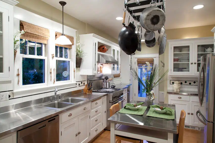 Kitchen with windows, hanging and recessed lighting fixtures