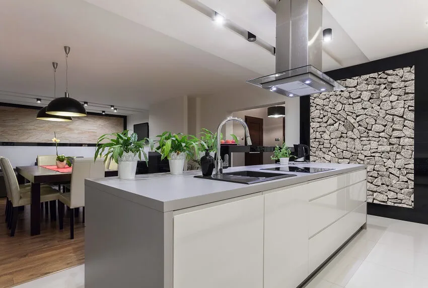 Kitchen with with cooktop, range hood and sink