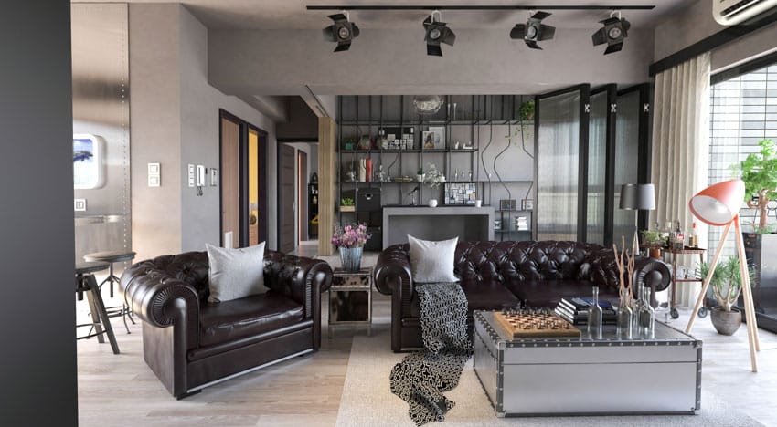 Living room brown leather sofa chairs light hardwood floors task lighting floor lamp windows curtains