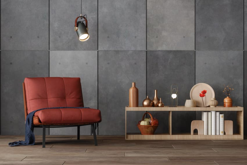Metal pendant light concrete panel wall red leather chair wood floor