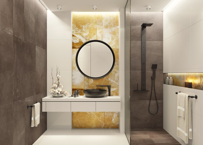 Modern bathroom with matte black sink showerhead mirror accent wall