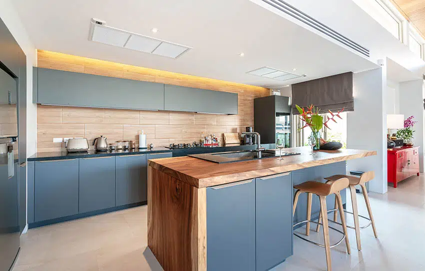 Modern kitchen grey cabinets butcher block backsplash countertops backlit ceiling 