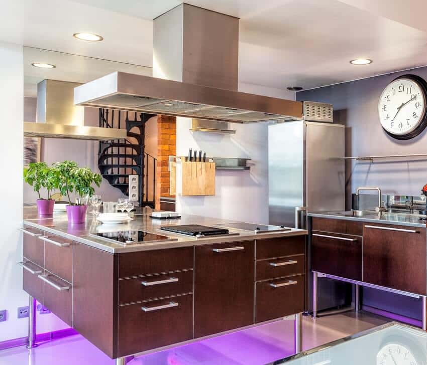 Modern kitchen interior with purple under cabinet lighting brass countertop and some kitchen furniture and decors