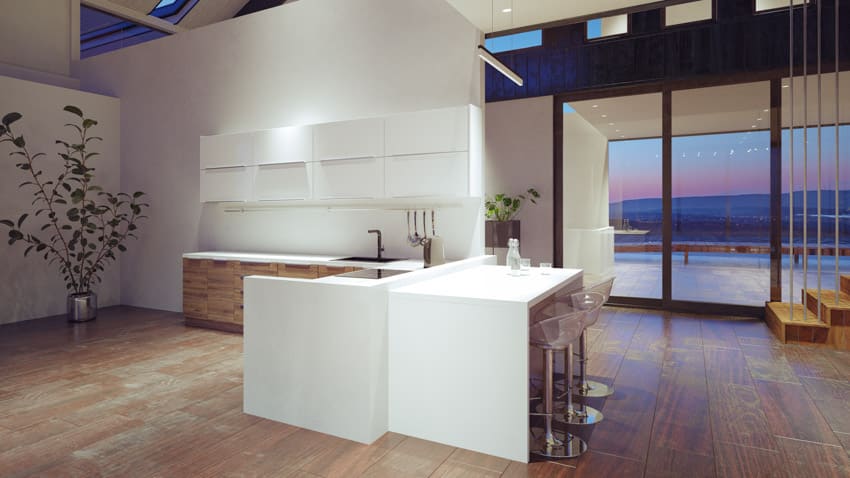 Modern designed kitchen with downlights and glass slab countertops