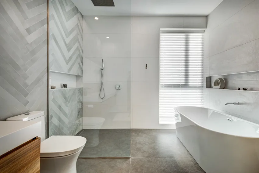 Open shower in bathroom tub tile wall toilet windows