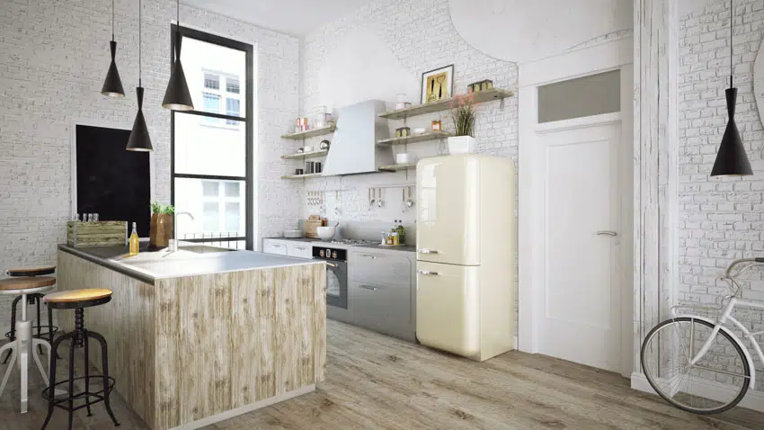 Zinc countertop, vintage looking refrigerator, black pendant lights and counter stools