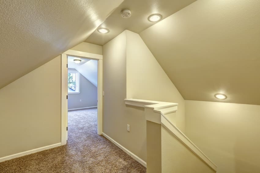 Staircase hallway with flush mounted lights