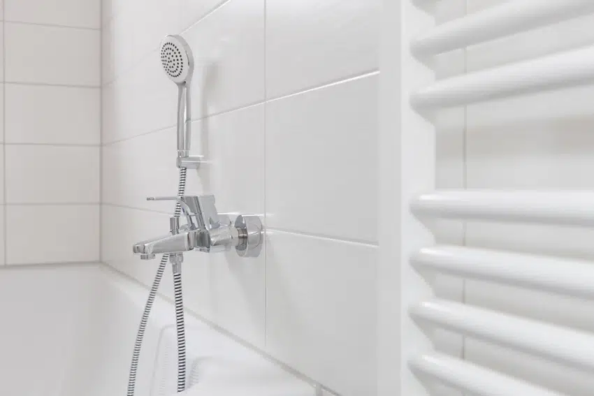 White shower wall with handheld shower
