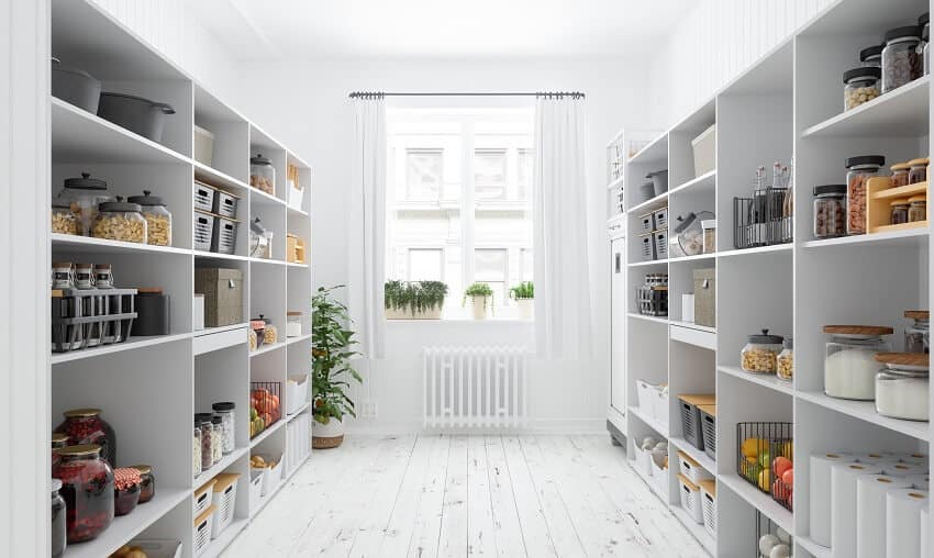 White walk-in pantry with wood floors paneled walls and window with plants and curtains
