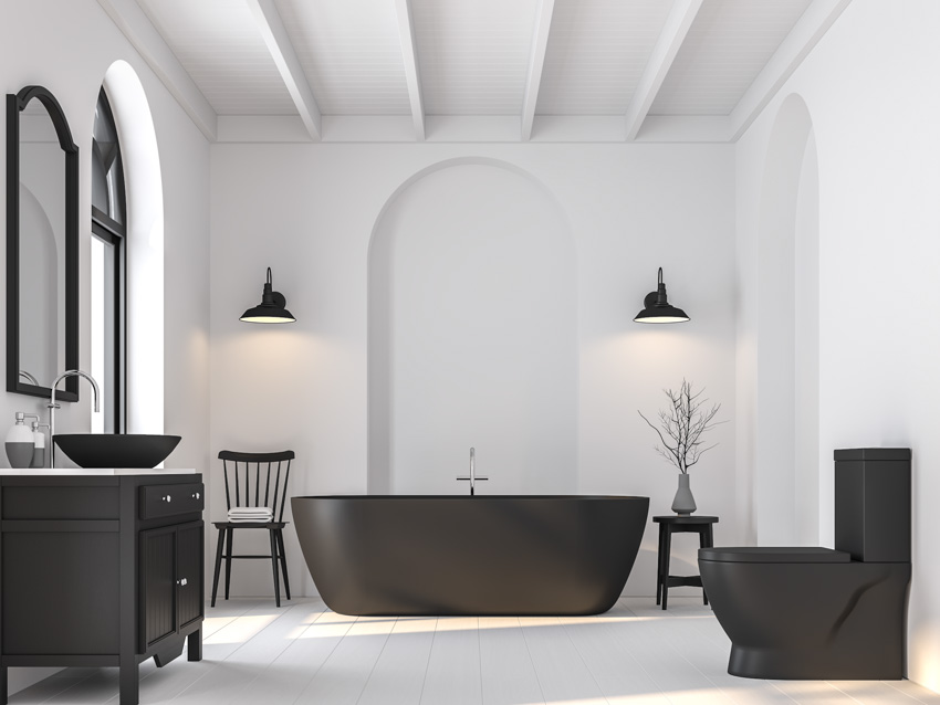 White wall bathroom matte black fixtures tub sink toilet vinyl windows drawer cabinet chair