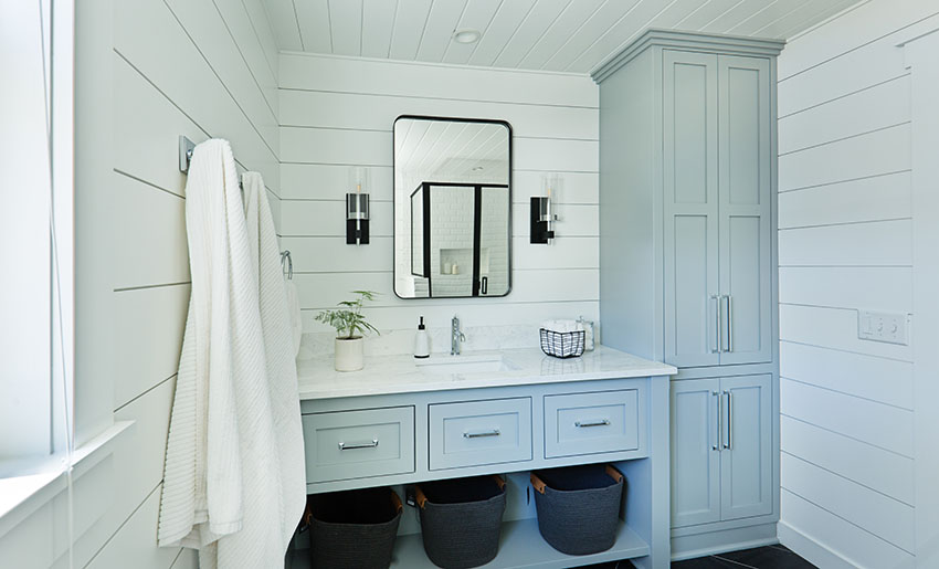 Bathroom vanity with long utility cabinet towel bar