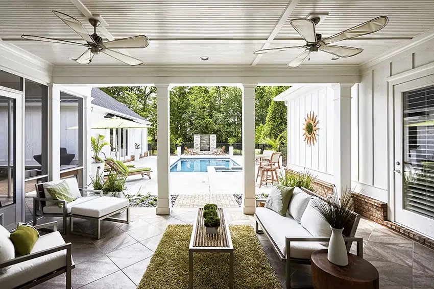 Patio with ceiling fans columns pool