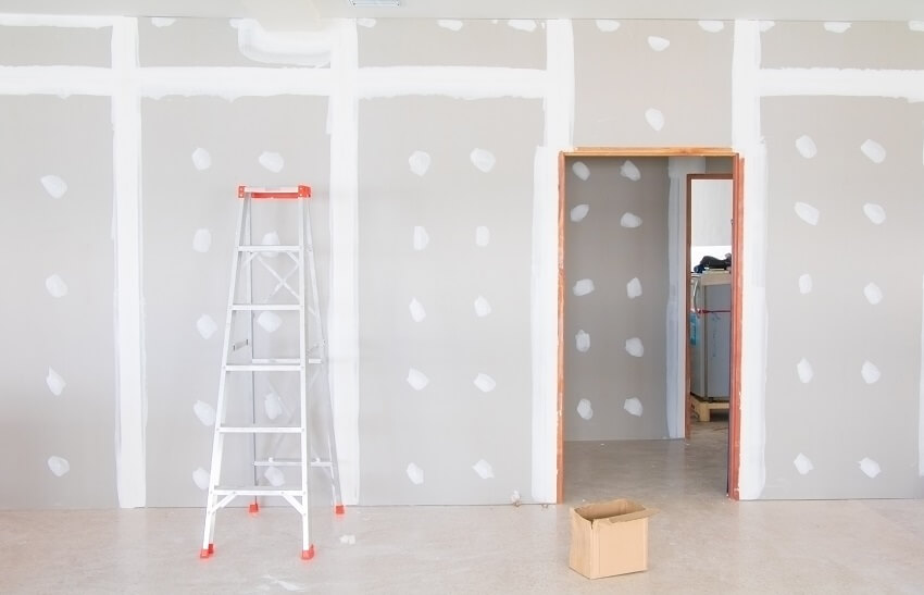 A-type ladder and drywall interior of home 