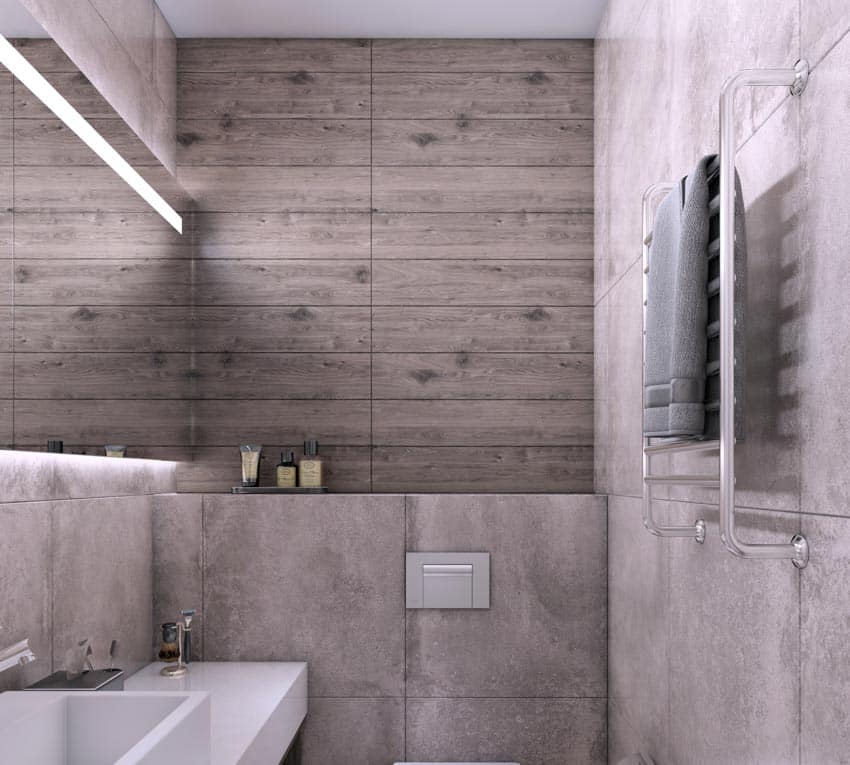 Bathroom with accent wall made of wood, mirror, and sink