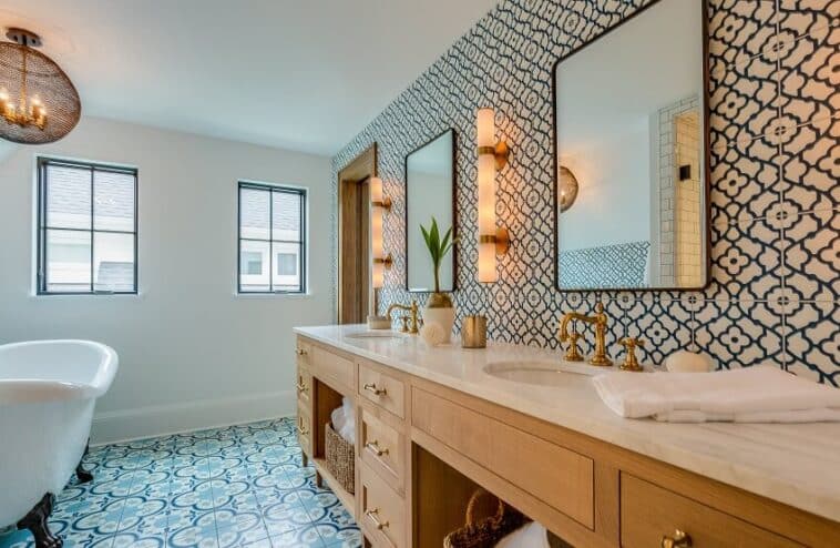 Brass Bathroom Hardware Finishes Accessories   Bathroom With Brass Hardware Blue And White Patterned Tile Floor And Wall Stone Countertops Lighting Fixtures And Free Free Standing Tub Is 758x494 