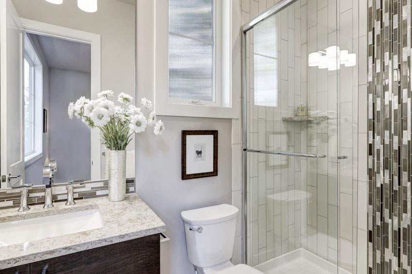 Bathroom with shower area and glass door