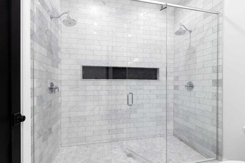 Bathroom with shower, subway, and mosaic tile wall design