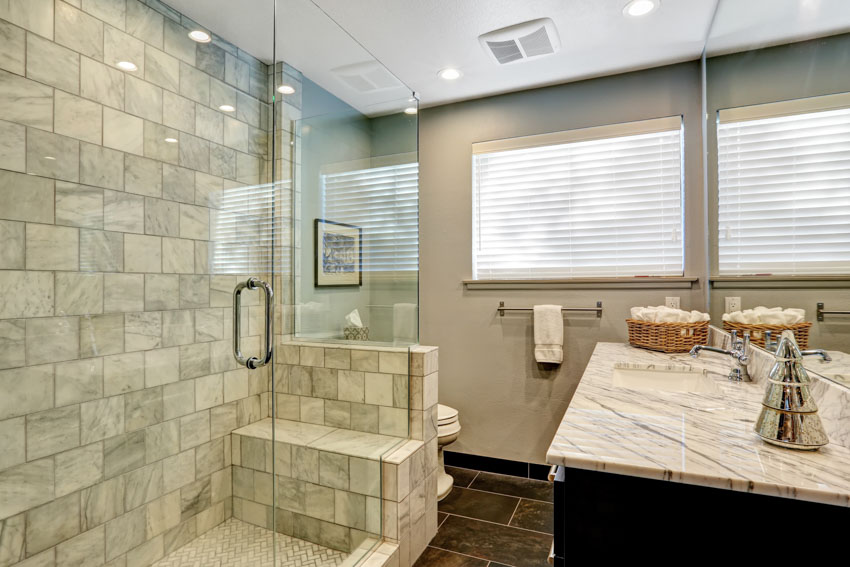 Bathroom with subway tile shower area, and countertop