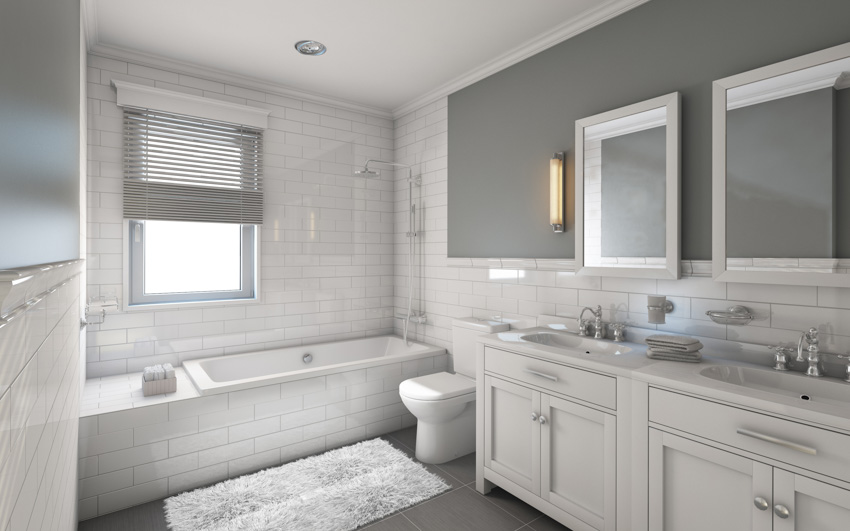 White tiled bathroom, windows and tub