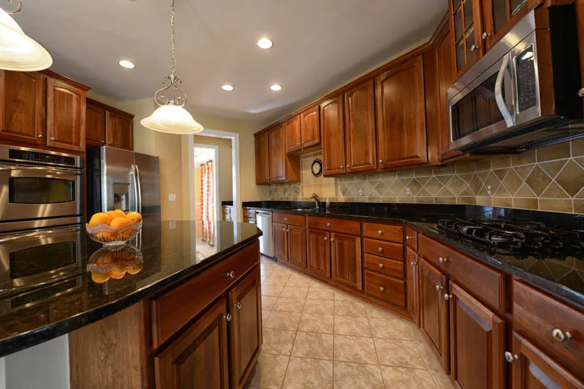 Beautiful kitchen with red oak and tile floors