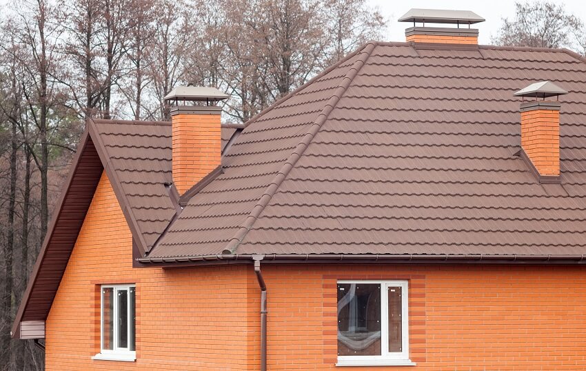 Brick house with stone coated metal roof tile plastic windows rain gutter and modular chimneys with rain cap