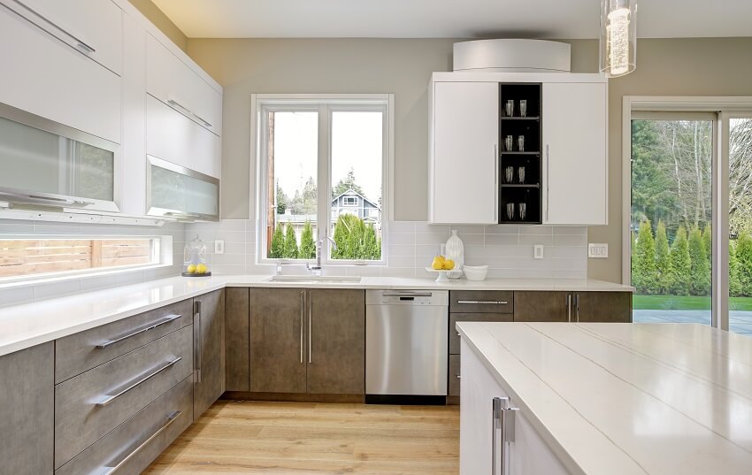 Bright Luxury kitchen with white quartz countertops subway tile backsplash natural brown wood cabinets and wood floor