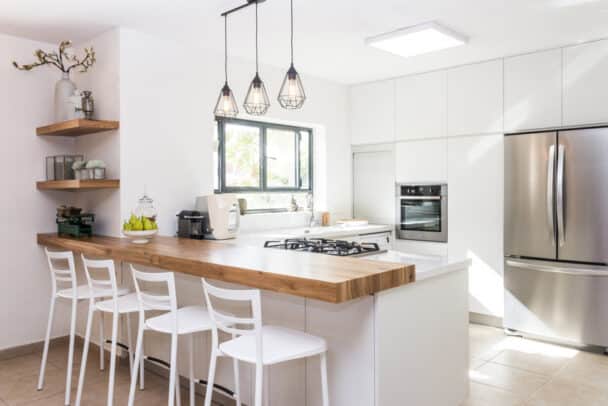 Bright Prefabricated Kitchen Space With Center Island Cabinets Pendant Light Windows And Shelves Is 608x406 