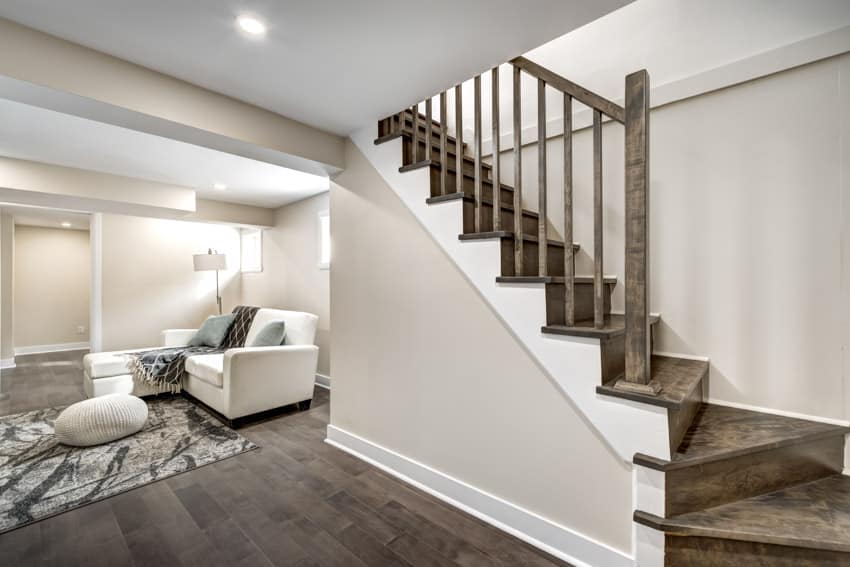 Brown painted stairs leading to basement with living space